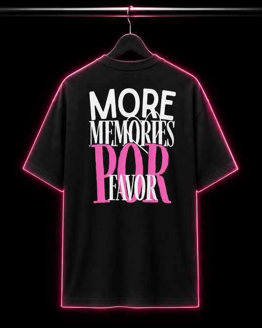 Black t-shirt with white and pink text on a hanger against a black background